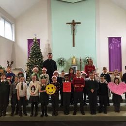 St Thomas Primary School children and Mrs Hamilton after Mass