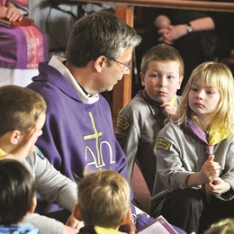 Reverend Muir with cubs and scouts for the Childrens talk