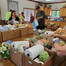 The FOR Andrews ministry group preparing boxes for distribution to the community