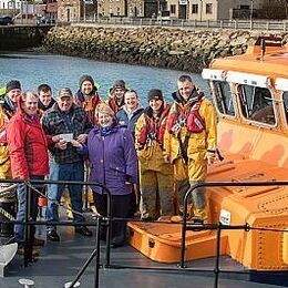 Lyall and Isabel handing over a cheque to Thurso Lifeboat