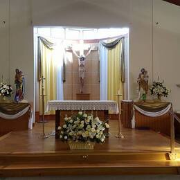 The altar, with Easter flowers - photo courtesy of Joyce Moreau Wrightman