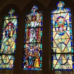 The Crucifixion, Ascension and Pentecost windows in the organ loft