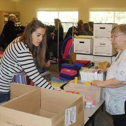 Checking items to bring to Redmond School District students in need