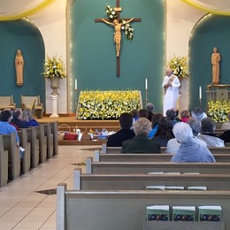 Deacon George blessing the Easter baskets