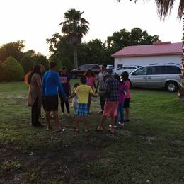 The youth praying for the church