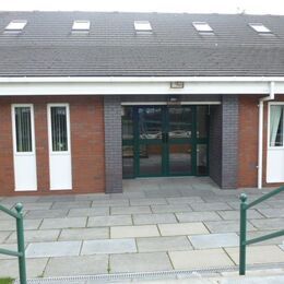 Steps leading to front entry ( disabled ramp to the left of steps)