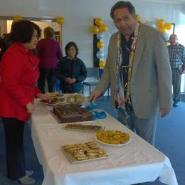 Ps Iliafi cutting the Father's Cake for Father's Day.