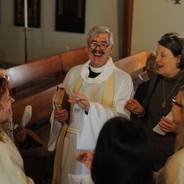 Rev. Lang Lowrey, center, shares a laugh with congregants and Rev. Ruth Pattison - photo courtesy of Phil Mosier