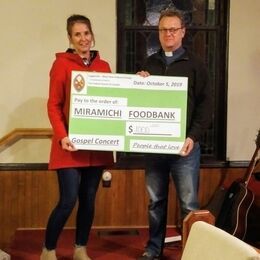 Rev. David Allan presenting the cheque to Jean Matchett, Coordinator at the Miramichi Community Food Bank