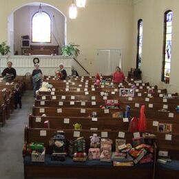 Rev Chong, Bev, Peggy and Patty (left to right) sorting toys