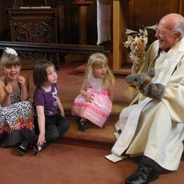 Vicar Dave's presentation with Mr. Giraffe and Mr. Jackal